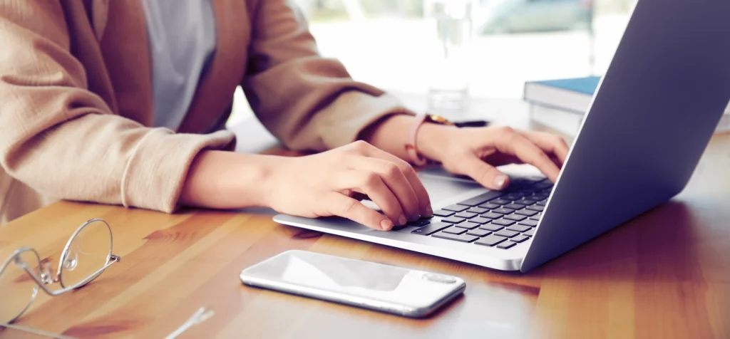 A person working at a laptop.